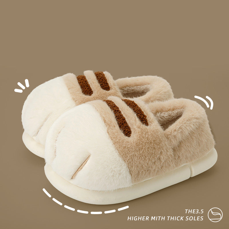 Pair of plush slippers with text on a brown background